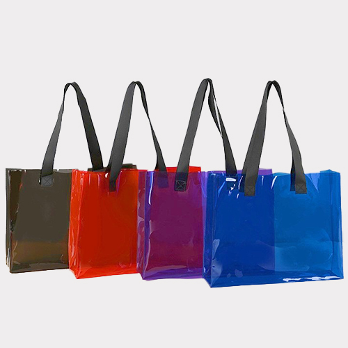 Clear PVC tote handbag in assorted colors with strong carrying handles