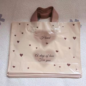 Transparent PE shopping tote bag with brown handles and printed logo
